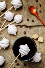 Berries marshmallows with glass of coffee
