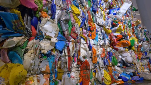 Pet bottle ready for recycling in a garbage sorting center. 4K.