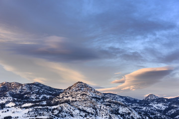 Snow Covered Mountain Range at Sunset