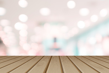 Wooden board empty table in front of blurred background. Perspective brown wood table over blurred store with bokeh  background - can be used mock up for display or montage your products.