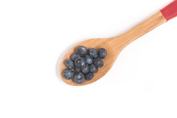 Blueberries into a spoon