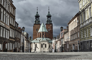 Fototapeta premium Paved street leading to the Gothic cathedral in Gniezno.