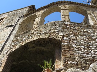 Arches on stone portal in old village