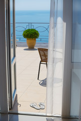 chair on terrace and sea horizon