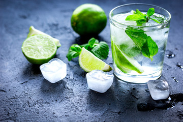 mojito in glass on dark background close up