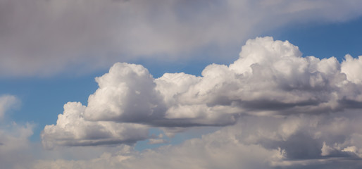 Blue sky with clouds and sun.
