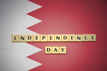 letters with text independence day on the national flag of bahrain.