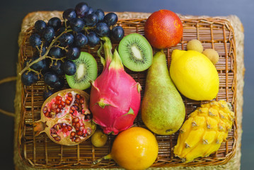 Mix of fresh fruits on wicker bascket