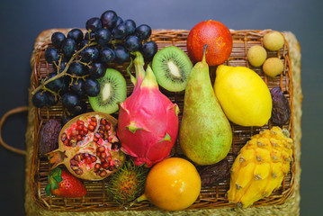 Mix of fresh fruits on wicker bascket