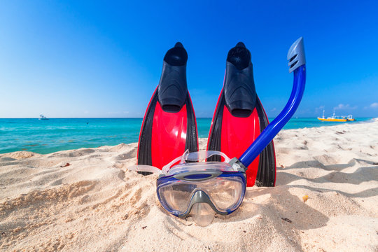 Snorkeling mask and fins on the tropical beach