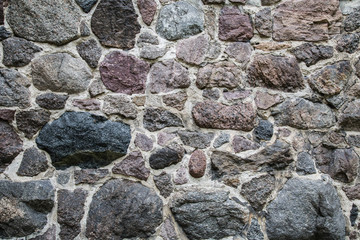 eine Wand aus Steinen (Feldsteine) als Hintergrund
