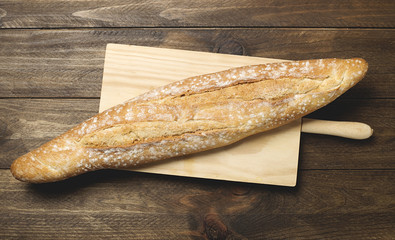 Bread on wooden table. Horizontal shoot.