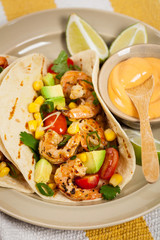 Shrimp Tacos with Corn and Avocado Salsa. Selective focus.