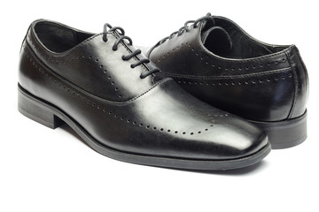 Classic black leather men's shoe isolated on white background.