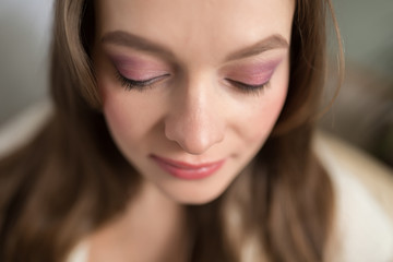 Obraz premium Closeup of young adult darling woman face with day makeup