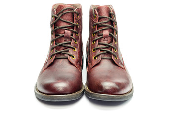 Stylish brown leather boots for men isolated on white background.
