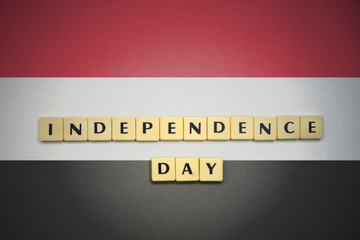 letters with text independence day on the national flag of yemen.