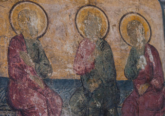 old icon of poorly preserved icons painted on the wall