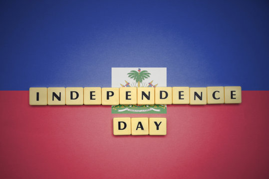 letters with text independence day on the national flag of haiti. - Powered by Adobe