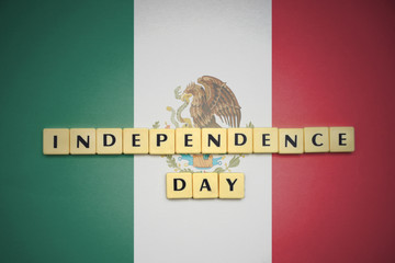 letters with text independence day on the national flag of mexico.