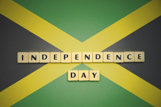 letters with text independence day on the national flag of jamaica.