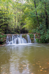 Fototapeta na wymiar Waterfall in the province of Garrotxa (Vall de Bianya) Catalonia, Spain