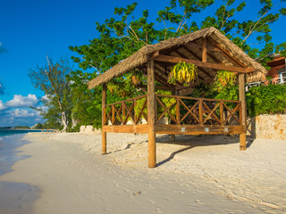 Hut With Suspended Flower Pots On Seven Mile Beach in the Caribbean, Grand Cayman, Cayman Islands