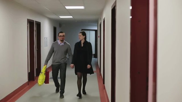 Beautiful couple walking in the hall the hospital.