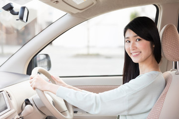 young asian woman in the car