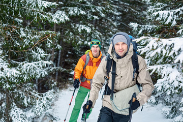 Fototapeta na wymiar hikers on the trail in the Carpathians mountains at winter