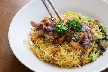 chinese noodle with sweet red pork on the table