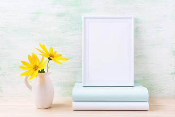 White frame mockup with two deep yellow rosinweed and books