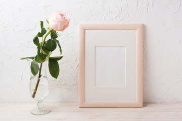 Wooden frame mockup with rose in exquisite glass vase