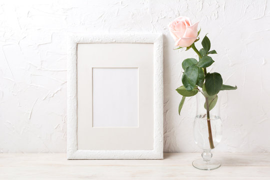 White frame mockup with rose in exquisite glass vase