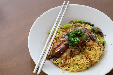 chinese noodle with sweet red pork on the table