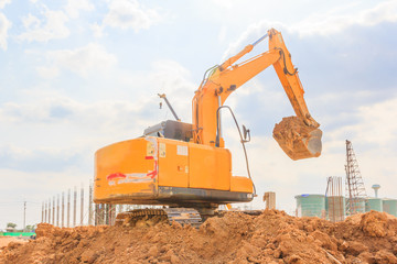 Excavators machine on a construction site against blue sky background