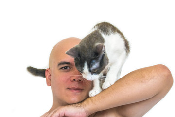 A man with a cat on his shoulders with a white background.