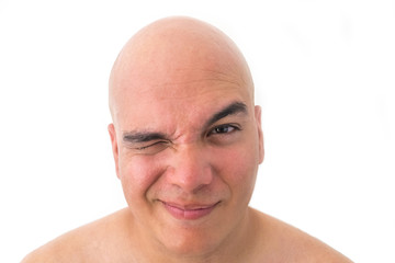 Obraz premium Face of a bald man in white background. Suspicious face.
