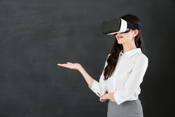 asian woman teacher presenting with VR headset device