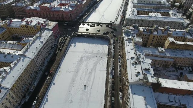 Rising to frozen Fontanka river. The Anichkov bridge and Beloselsky-Belozersky Palace on Nevsky avenue at winter season. Saint-Petersburg, Russia