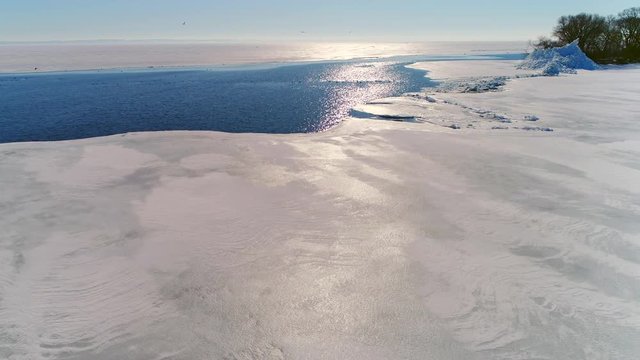 Lake Winnebago, WI, Ice shoves build small mountains of ice along the shoreline; sometimes destructive, they are driven by winds that grip the surface ice and jamb it into the opposite shore.