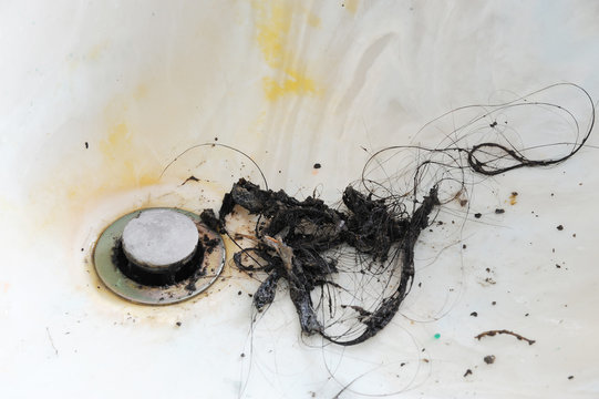 Cleaning Water Sink Clogged By Hair In Bathroom