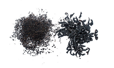 Black granulated tea leaf and a white background