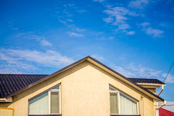 Fototapeta na wymiar metal roof against the sky