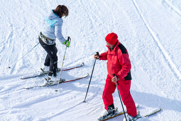 Fototapeta na wymiar Skiers on the slopes