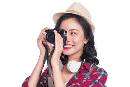 Woman travel. Young beautiful asian woman traveler taking pictures on white background