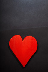 Holidays gift and heart on a black background. Valentines day