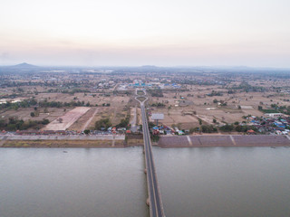 Aerial view of Bridge over Mae khong river at twilight sky.
bridge in the night of Second Thai–Lao Friendship Bridge.
connects Mukdahan Province in Thailand with Savannakhet in Laos.

