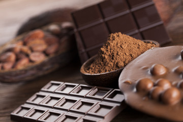 Chocolate bar, candy sweet, dessert food on wooden background