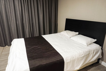 Fototapeta na wymiar double bed in luxury hotel bedroom